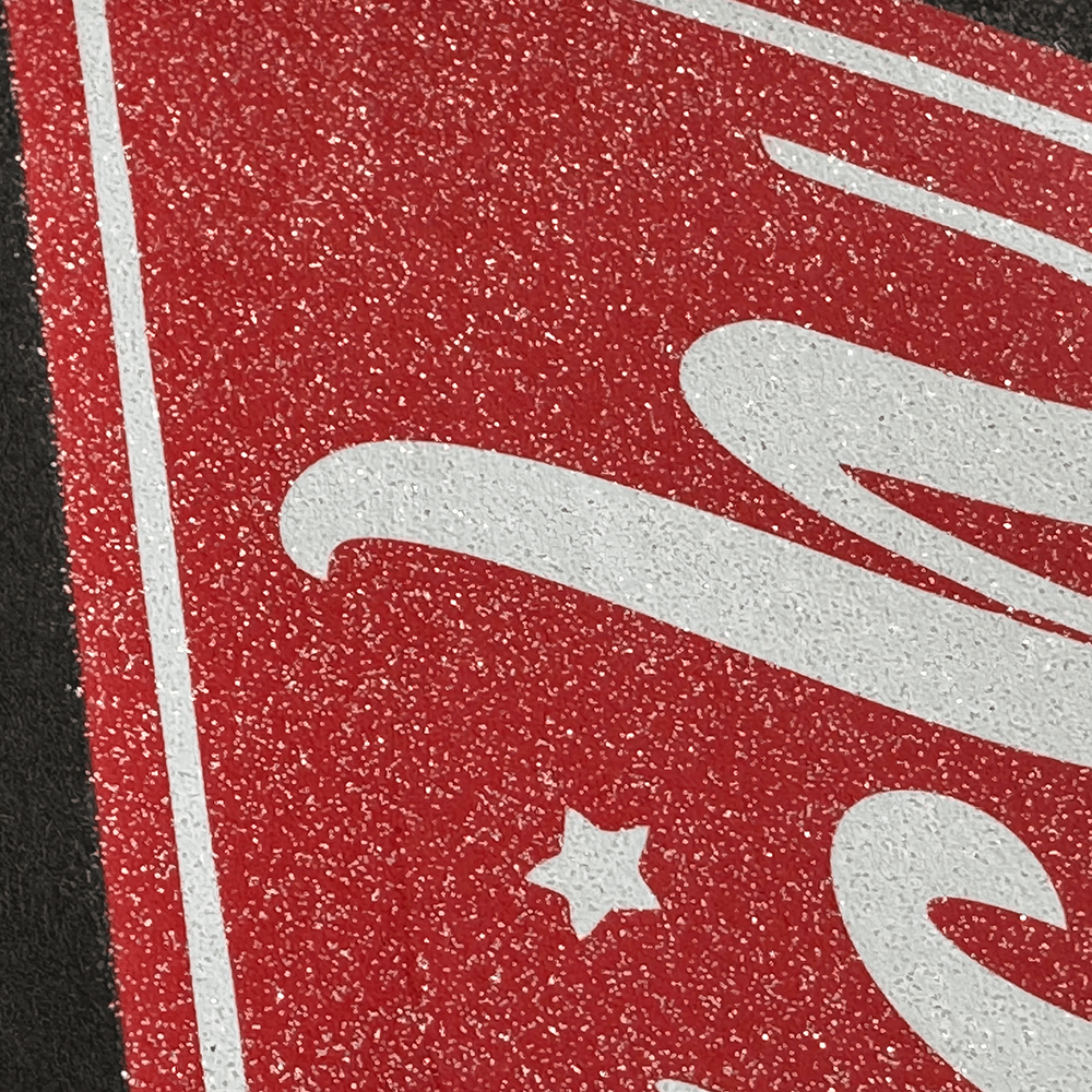 Close-up of glitter DTF film showing shimmer and sparkle in direct-to-film print
